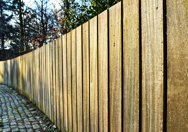 What are the best practices for maintaining a wooden fence in a rainy Liverpool climate?